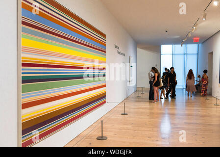 Modern art museum, view of New Day (1967) by Kenneth Noland sited inside the Whitney Museum Of American Art, Manhattan, New York City, USA Stock Photo