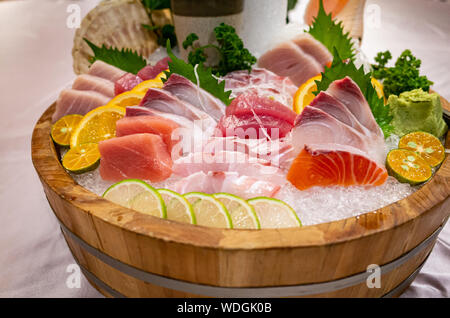 Assortment of Fresh Delicious Sashimi on Ice Stock Photo