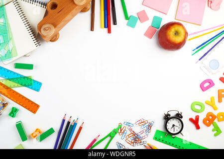 school supplies: multicolored wooden pencils, paper stickers, paper clips, pencil sharpener, copy space Stock Photo