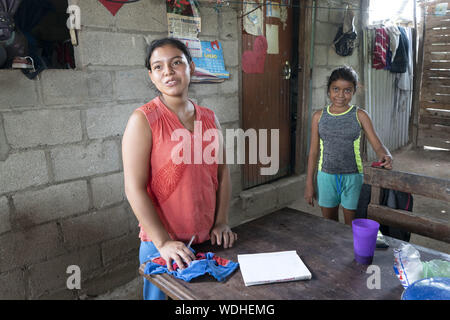 Usumatlan, Zacapa, Guatemla. 10th Aug, 2019. Portraits of the Morales Lopez family who live in a modest home in Usumatlan, Zacapa in the east central highlands of Guatemala. Mother Irma Noemi Morales Lopez left the family under the care of her husband Eliu and young teenage daughter to make the perilous journey to the United States to find work. Credit: Bob Daemmrich/ZUMA Wire/Alamy Live News Stock Photo
