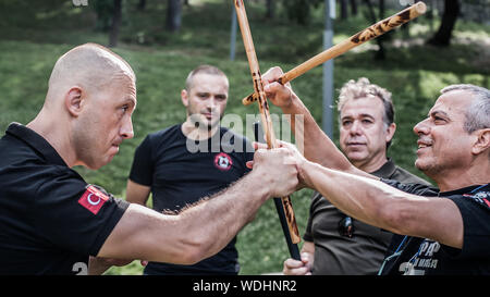 ISTANBUL, TURKEY - Maj 30 - Jun 02. 2019. Group of martial arts students practice filipino escrima stick fighting on GENERAL MEETING OF KAPAP INSTRUCT Stock Photo