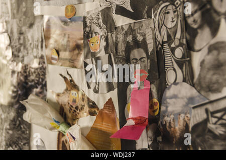 Landscape view of a generic pop hand made collage board full with colorful magazine cuts and pieces of paper. Frida Kahlo can be seen in focus Stock Photo