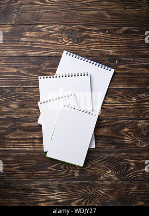 Empty open notebooks on wooden background Stock Photo