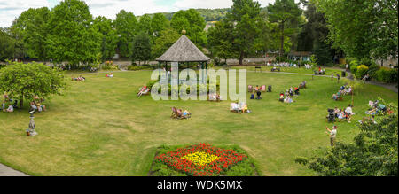 BATH, ENGLAND - JULY 2019: Panoramic view of people in Parade Gardens in the centre of Bath. Stock Photo