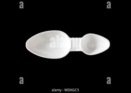 Medicine measuring spoon. Stock Photo