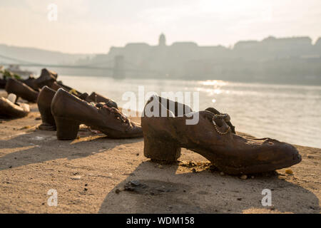 Budapest, Hungary - 11.12.2018: Shoes symbolizing the massacre of people shot at the river Danube in Budapest, Hungary. Travel. Stock Photo