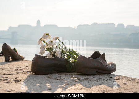 Budapest, Hungary - 11.12.2018: Shoes symbolizing the massacre of people shot at the river Danube in Budapest, Hungary. Travel. Stock Photo
