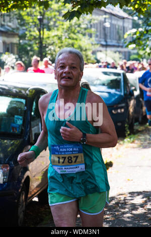 Runners in the York 10k going down Newton Terrace towards Victoria Bar. Stock Photo