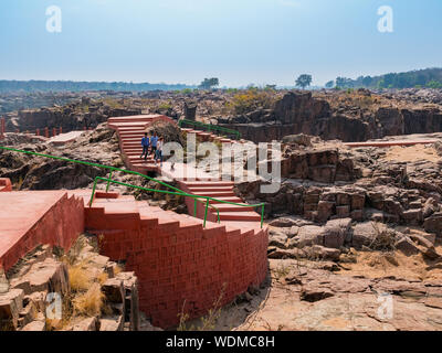 Tourists walking on red platform inside the Ken Gharial Sanctuary, Khajuraho, Madhya Pradesh, India, Asia Stock Photo