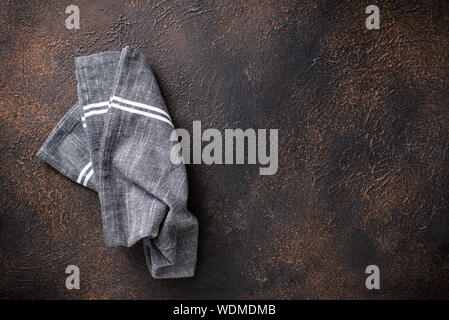 Gray linen napkin on rusty table Stock Photo