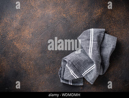Gray linen napkin on rusty table Stock Photo