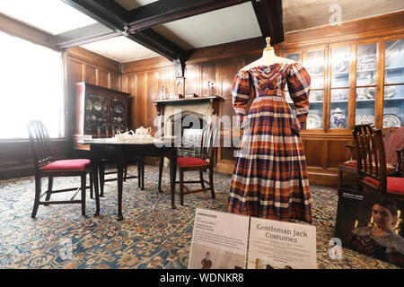 Marian Lister's costume in Shibden Hall, historic house, home of Anne Lister and film location for the BBC's 'Gentleman Jack', Halifax, West Yorkshire Stock Photo