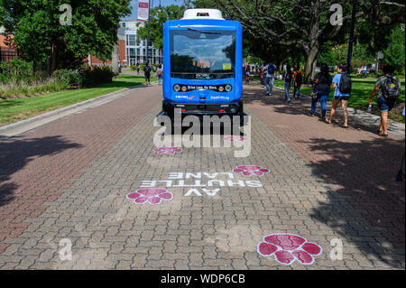 An autonomous electric shuttle operates on a 1-mile closed-loop route ...