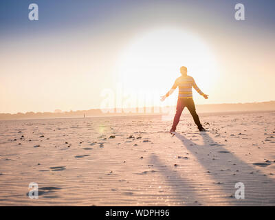 Silhouette of a man on the riverbed of the Ganges River in Varanasi, Uttar Pradesh, India, Asia Stock Photo