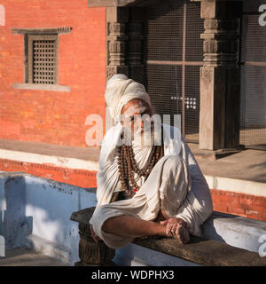 Sadhu Holy Man at Ancient Hindu Nepali Mandir Temple, dedicated to Lord Shiva,  Varanasi, Uttar Pradesh, India, Asia Stock Photo