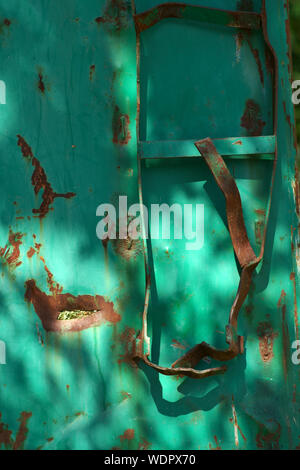 The bent ladder of a rusted container. Stock Photo