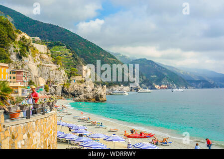 The sea and sandy beach of Spiaggia di Fegina at the Cinque Terre Italy resort village of Monterosso al Mare. Stock Photo