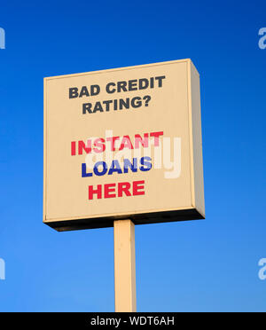 Large outdoor sign advertising instant loans for people with bad credit rating Stock Photo