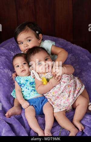 Group of small funny babies watching in camera Stock Photo