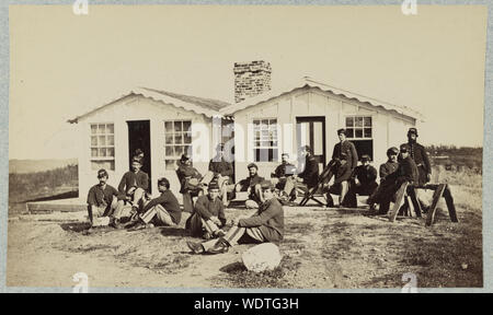 Group of soldiers outside winter quarters Stock Photo