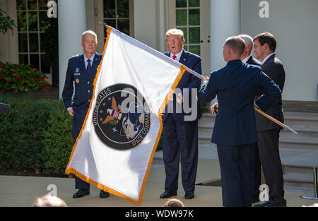 Military personnel unravel the flag prior to an NFL football game between  the Los Angeles Rams and the Arizona Cardinals, Sunday, Dec. 1, 2019, in  Glendale, Ariz. (AP Photo/Ross D. Franklin Stock