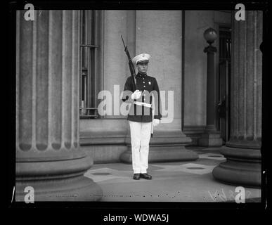 Guarding the U.S. Treasury. One of the detatchment of the U.S. Marines, dressed in full dress uniform with fixed bayonet, guarding the United States Treasury until after the Klan Parade on Saturday, August 8th Abstract/medium: 1 negative : glass  4 x 5 in. or smaller Stock Photo