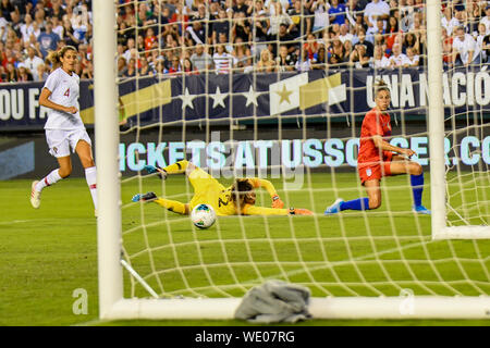 Carli Lloyd of the United States Women's Soccer Team - shot past a diving goalie as the USWNT defeats the Portugal womens national team 4-0 during the United States Womens World Cup victory tour Stock Photo