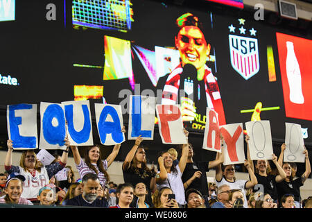 Equal pay sign - young girls and US soccer supporters hold up an equal pay sign during the United States Women's National Team football match against Portugal. The USWNT won 4-0 in an international friendly during their World Cup victory tour. Credit: Don Mennig/Alamy Live News Stock Photo