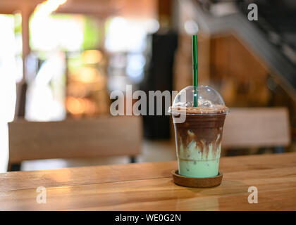 Ice chocolate mint on wooden table in cafe Stock Photo