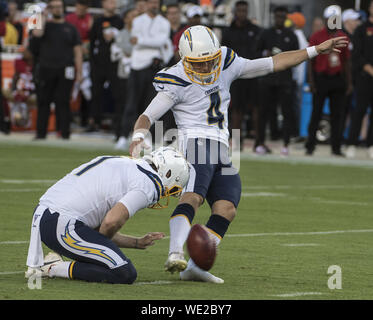 Los Angeles Chargers kicker Mike Badgley (4) kicks a field goal from the hold of Ty Long (1) in the first quarter against the San Francisco 49ers at Levi's Stadiium in Santa Clara, California on Thursday, August 29, 2019. The Chargers took the pre season game 27-24.    Photo by Terry Schmitt/UPI Stock Photo