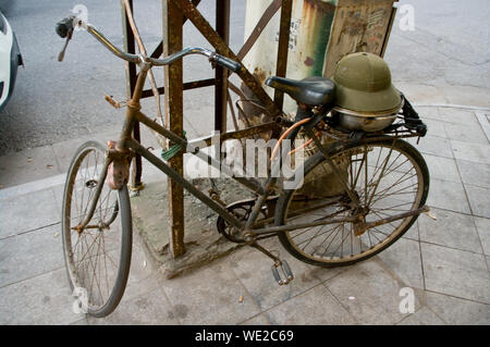 High Angle View Of Rusty Bicycle Parked On Footpath