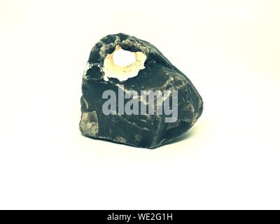 Sharp broken basalt stone with some cavity inside, isolated on white ...