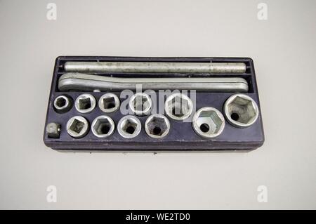 Tool kit - wrench heads with a ratchet wrench, old in a black box Stock Photo
