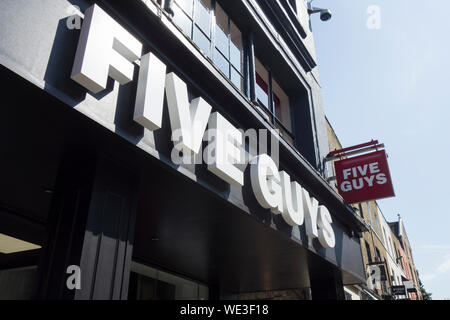 Five Guys fast food burger restaurant signage on Richmond Hill, Surrey, UK Stock Photo
