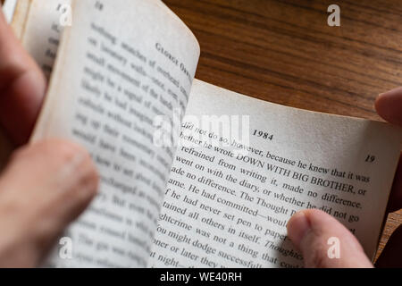 Bangkok, Thailand - August 19, 2019 : People reading "1984" novel by George Orwell. Stock Photo