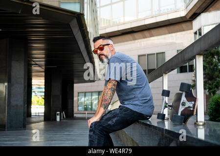 Skater with a tattoo resting Stock Photo