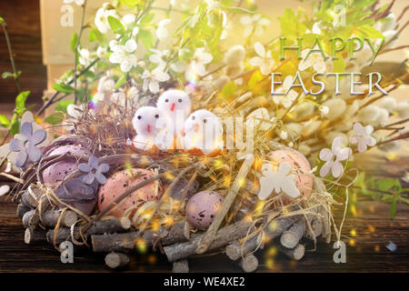 Three Easter chicks with happy easter text. Easter holiday concept. Stock Photo