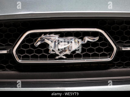 Cracow, Poland - May 18, 2019: Ford Mustang metalic logo closeup on the car displayed at Moto Show in Cracow Poland. Exhibitors present  most interest Stock Photo