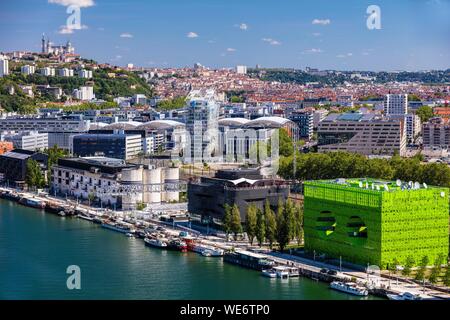 France, Rhone, Lyon, district of La Confluence in the south of the peninsula, first French quarter certified sustainable by the WWF, view of the quai Rambaud along the old docks with the Green Cube, the Sucriere, the Ycone tower and Notre Dame de Fourviere Basilica Stock Photo
