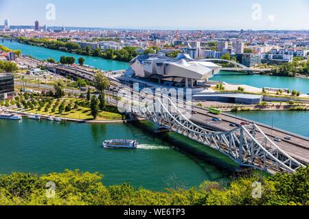 France, Rhone, Lyon, district of La Confluence in the south of the peninsula, first French quarter certified sustainable by the WWF, view on the railway and road bridges of the Mulatiere, the Museum of Confluences, museum of sciences and companies located at the confluence of the Rhone and Saone, the Incity Tower and the Crayon Stock Photo