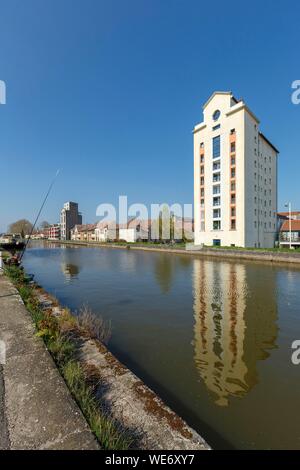 France, Meurthe et Moselle, Nancy, former grain silos (1941-1942) now apartment buildings on the Meurthe canal Stock Photo