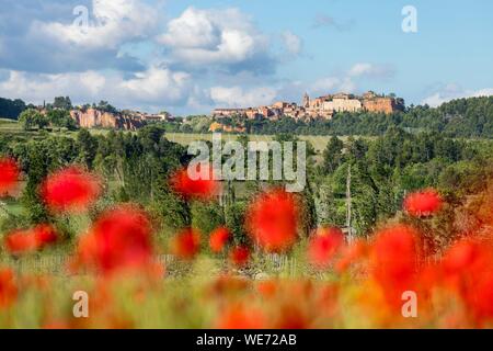 France, Vaucluse, regional natural park of Luberon, Roussillon, labeled the most beautiful villages of France with poppy field in the foreground Stock Photo