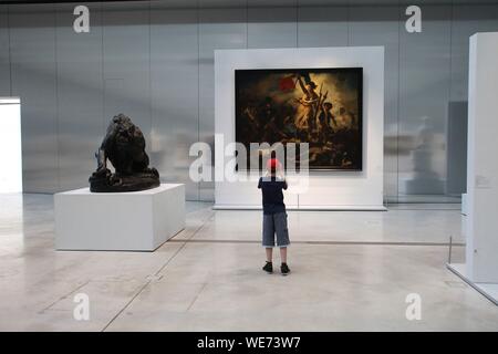 France, Pas de Calais, Lens, Louvre Lens Museum created by the Japanese architecture agency SANAA and architects Celia Imrey and Tim Culbert, Galerie du Temps, painting La Liberte guiding the people of Eugene Delacroix paints in 1830 Stock Photo