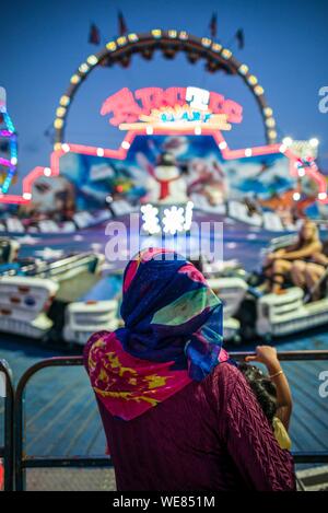 United States, New England, Massachusetts, Cape Ann, Gloucester, Saint Peters Fiesta, Traditional Italian Fishing Community Festival, carnival people, woman in Middle Eastern clothing Stock Photo