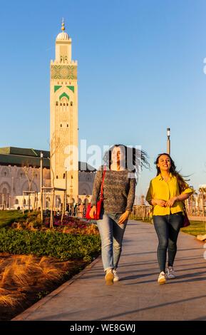 Morocco, Casablanca, young women on the forecourt of the Hassan II mosque Stock Photo
