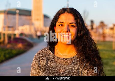 Morocco, Casablanca, young women on the forecourt of the Hassan II mosque Stock Photo