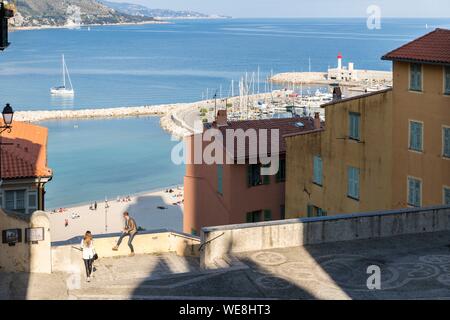 France, Alpes-Maritimes, Menton, view on the beach of Garavan Bay from the forecourt of the basilica of Saint-Michel Stock Photo