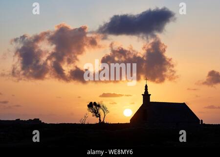 France, Finistere, Iroise Sea, Iles du Ponant, Parc Naturel Regional d'Armorique (Armorica Regional Natural Park), Ile de Sein, labelled Les Plus Beaux de France (The Most Beautiful Village of France), the Saint Corentin Chapel at sunset Stock Photo