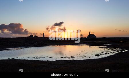 France, Finistere, Iroise Sea, Iles du Ponant, Parc Naturel Regional d'Armorique (Armorica Regional Natural Park), Ile de Sein, labelled Les Plus Beaux de France (The Most Beautiful Village of France), the Saint Corentin Chapel at sunset Stock Photo