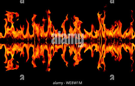 Fire flames on Abstract art black background, Burning red hot sparks rise, Fiery orange glowing flying particles Stock Photo